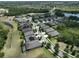 Scenic aerial shot of homes with lush landscaping, solar panels, and a peaceful neighborhood setting at 6440 Maiden Sea Dr, Apollo Beach, FL 33572