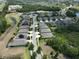 Wide aerial image showing a quiet residential street lined with well-maintained homes and green spaces at 6440 Maiden Sea Dr, Apollo Beach, FL 33572