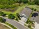 Aerial view of the home, showing the pool, landscaping, and neighborhood at 6440 Maiden Sea Dr, Apollo Beach, FL 33572