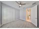 Cozy bedroom with a ceiling fan, carpet, and a large closet at 6440 Maiden Sea Dr, Apollo Beach, FL 33572