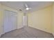 Inviting bedroom featuring a ceiling fan and spacious closet at 6440 Maiden Sea Dr, Apollo Beach, FL 33572