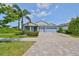 Charming one-story home featuring a three-car garage, well-manicured landscaping and a paver driveway at 6440 Maiden Sea Dr, Apollo Beach, FL 33572