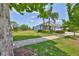 Well-maintained home with lush lawn, mature trees, and manicured landscaping at 6440 Maiden Sea Dr, Apollo Beach, FL 33572