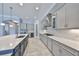 Modern kitchen featuring granite countertops, stainless steel appliances, and custom cabinetry at 6440 Maiden Sea Dr, Apollo Beach, FL 33572