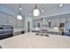 Gourmet kitchen featuring stainless steel appliances, custom cabinets, and center island with sink at 6440 Maiden Sea Dr, Apollo Beach, FL 33572