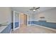 A home office featuring a chandelier, transom glass doors, and plenty of natural light at 6440 Maiden Sea Dr, Apollo Beach, FL 33572