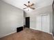Bedroom with a ceiling fan and plenty of closet space at 6994 Fort King Rd, Zephyrhills, FL 33541