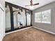 Bedroom with a mural of a forest, a ceiling fan, and a window at 6994 Fort King Rd, Zephyrhills, FL 33541