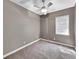 Neutral bedroom with a modern ceiling fan, one window, and plush neutral carpeting throughout at 6994 Fort King Rd, Zephyrhills, FL 33541