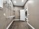 Spacious walk-in closet with wood floors, shelving, and natural light at 6994 Fort King Rd, Zephyrhills, FL 33541