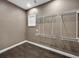 Spacious walk-in closet with wood floors, shelving, and a window at 6994 Fort King Rd, Zephyrhills, FL 33541