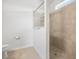 Bathroom featuring tiled shower with glass door at 9309 Tradewater Oaks Ct, Riverview, FL 33578