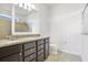 Bathroom featuring double vanity with granite countertop and a tiled shower at 9309 Tradewater Oaks Ct, Riverview, FL 33578
