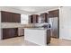 Kitchen with a stainless steel refrigerator, an island, and stainless steel dishwasher at 9309 Tradewater Oaks Ct, Riverview, FL 33578