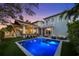 Stunning backyard oasis featuring a sparkling pool and outdoor seating area, perfect for entertaining at 1001 S Oregon Ave, Tampa, FL 33606