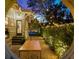 Backyard of the home featuring an outdoor kitchen and landscaped space with lights at 1001 S Oregon Ave, Tampa, FL 33606