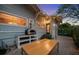 The backyard outdoor kitchen with pizza oven and dining space at 1001 S Oregon Ave, Tampa, FL 33606