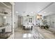 Bright bathroom with a free-standing tub, glass shower, and marble countertops at 1001 S Oregon Ave, Tampa, FL 33606