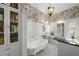 Charming bathroom with subway tile, patterned wallpaper, and a vintage-style soaking tub at 1001 S Oregon Ave, Tampa, FL 33606