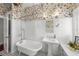 Bright bathroom with white subway tile, black and white flooring, and vintage-style fixtures at 1001 S Oregon Ave, Tampa, FL 33606