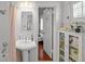 Classic white bathroom with subway tile and pedestal sink at 1001 S Oregon Ave, Tampa, FL 33606
