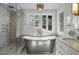 Modern bathroom featuring a glass-enclosed shower and a free-standing tub at 1001 S Oregon Ave, Tampa, FL 33606