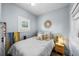 Cozy bedroom with a soft color palette, a plush bed, and natural light from window at 1001 S Oregon Ave, Tampa, FL 33606