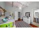 A cozy bedroom with a light-blue vaulted ceiling with wood beams at 1001 S Oregon Ave, Tampa, FL 33606