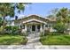 Charming bungalow with a manicured lawn and beautiful landscaping, creating great curb appeal at 1001 S Oregon Ave, Tampa, FL 33606