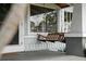 Close-up of front porch with a wooden swing and stylish exterior at 1001 S Oregon Ave, Tampa, FL 33606