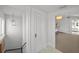 Hallway with view into bedroom. Features include hardwood floors, white walls, and modern light fixture at 1001 S Oregon Ave, Tampa, FL 33606