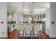 Bright, spacious kitchen with stainless appliances, a center island with seating, and unique wall coverings at 1001 S Oregon Ave, Tampa, FL 33606