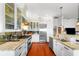 Open-concept kitchen with a gas range, stainless steel refrigerator, and granite countertops at 1001 S Oregon Ave, Tampa, FL 33606