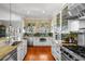 View of kitchen with stainless steel appliances, granite countertops, and unique wall décor at 1001 S Oregon Ave, Tampa, FL 33606
