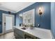 Kitchenette featuring white countertops, modern cabinetry, and stainless steel beverage cooler at 1001 S Oregon Ave, Tampa, FL 33606