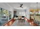 Bright living room featuring hardwood floors, neutral walls, and large windows for plenty of natural light at 1001 S Oregon Ave, Tampa, FL 33606