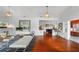 Spacious living room with hardwood floors, white walls, and stylish furnishings, showcasing an open floor plan at 1001 S Oregon Ave, Tampa, FL 33606