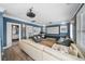 Cozy living room with a projector screen, comfortable seating and open doorway to bathroom at 1001 S Oregon Ave, Tampa, FL 33606