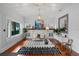 Bright living room featuring hardwood floors, a modern fireplace, and ample natural light at 1001 S Oregon Ave, Tampa, FL 33606