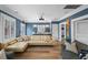 Stylish living room features a large sectional sofa, built-in wet bar, and ample lighting at 1001 S Oregon Ave, Tampa, FL 33606