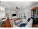 Inviting living room with hardwood floors, ceiling fan, and sliding doors leading to the outside patio at 1001 S Oregon Ave, Tampa, FL 33606