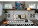 Bright living room featuring hardwood floors, a modern fireplace, and ample natural light at 1001 S Oregon Ave, Tampa, FL 33606