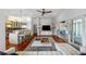 Spacious living room with a modern design, hardwood floors, and kitchen view with island seating at 1001 S Oregon Ave, Tampa, FL 33606