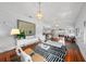 Inviting living room featuring a large mirror, stylish accents, and open layout at 1001 S Oregon Ave, Tampa, FL 33606