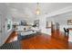 Open-concept living room with hardwood floors, stylish decor, and great natural light with an open floor plan at 1001 S Oregon Ave, Tampa, FL 33606
