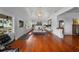 Bright, open living room featuring hardwood floors and abundant natural light from large windows at 1001 S Oregon Ave, Tampa, FL 33606