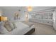 Bright main bedroom featuring a large window, neutral decor, and ensuite bathroom at 1001 S Oregon Ave, Tampa, FL 33606
