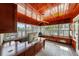 Sunlit wood-paneled office with custom cabinetry and a built-in window bench at 1001 S Oregon Ave, Tampa, FL 33606