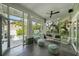 Covered patio is open to a backyard swimming pool with multiple seating arrangements at 1001 S Oregon Ave, Tampa, FL 33606