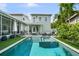 Backyard of the home featuring the pool with integrated spa and patio area at 1001 S Oregon Ave, Tampa, FL 33606